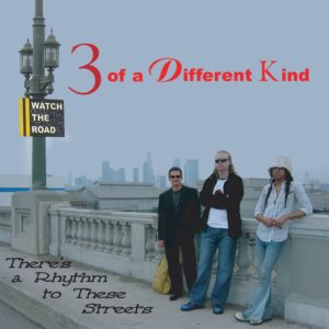 3 Of A Different Kind - There's A Rhythm To These Streets